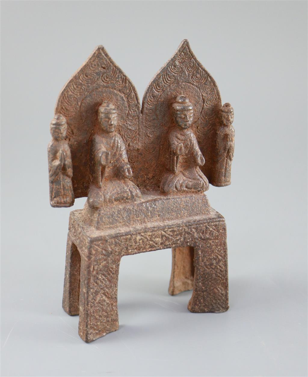 A Chinese cast iron votive group of two Buddhas and two attendants, Wei dynasty or later, 15cm high